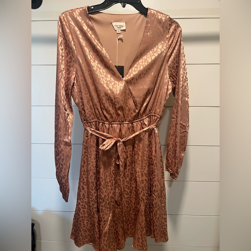 143 Story by Line up dress. Brand new. Rose gold color size medium.
